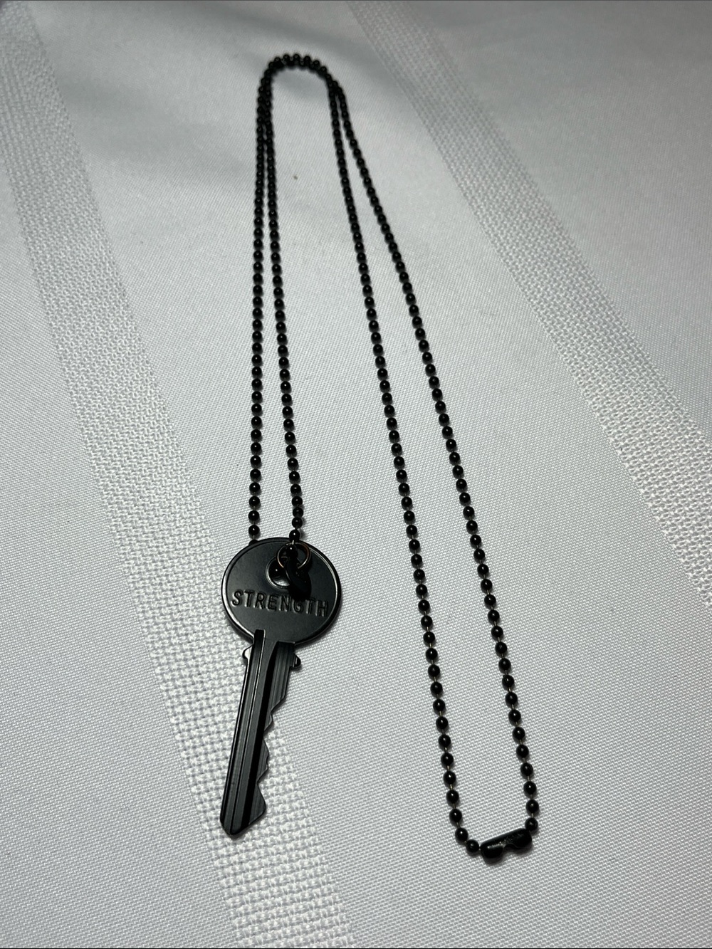 The GIVING KEYS Black 'Strength' Key Pendant Necklace
Like new
